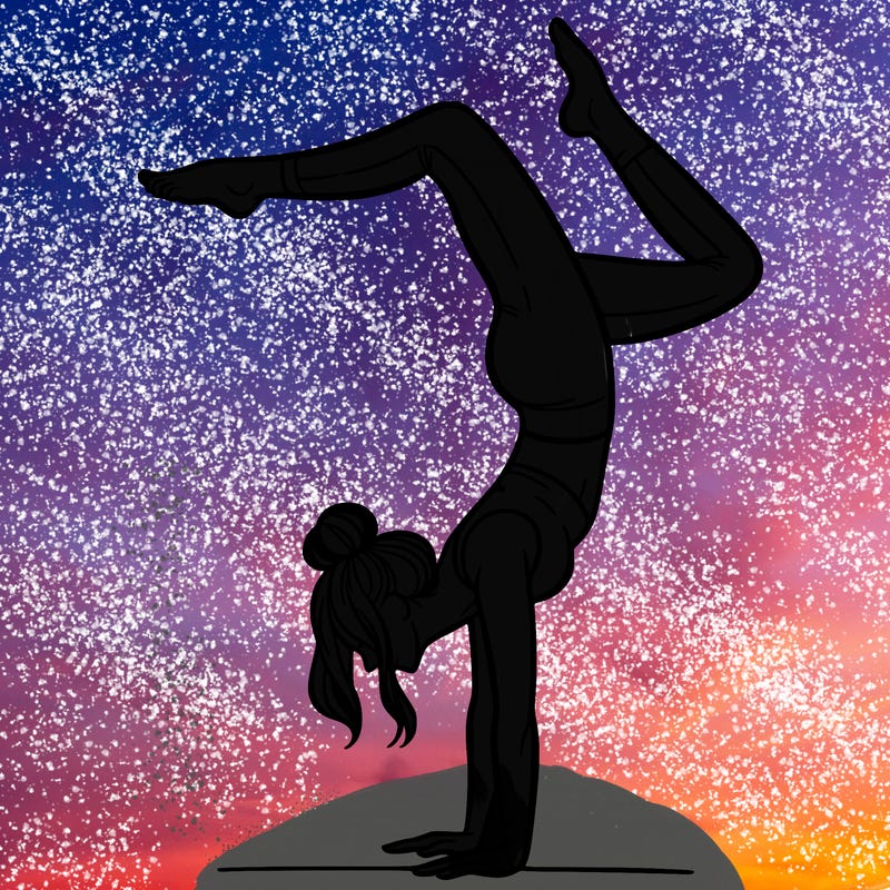 a woman doing a handstand