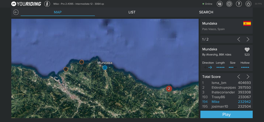 YouRiding - Surf and Bodyboard - A satellite map view in the YouRiding app showing the Mundaka surf spot in Spain with wave statistics and player rankings.