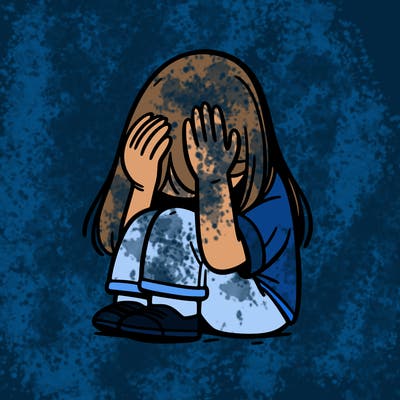 girl sitting down covering her head