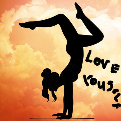 a woman doing a handstand