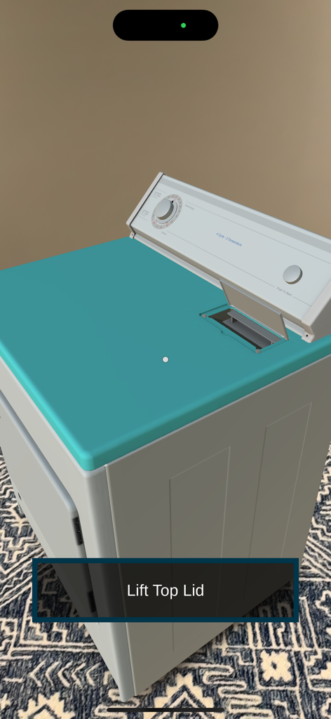 Appliance Repair Sim: Dryer - Augmented reality view of a dryer simulator with an instruction to lift the top lid