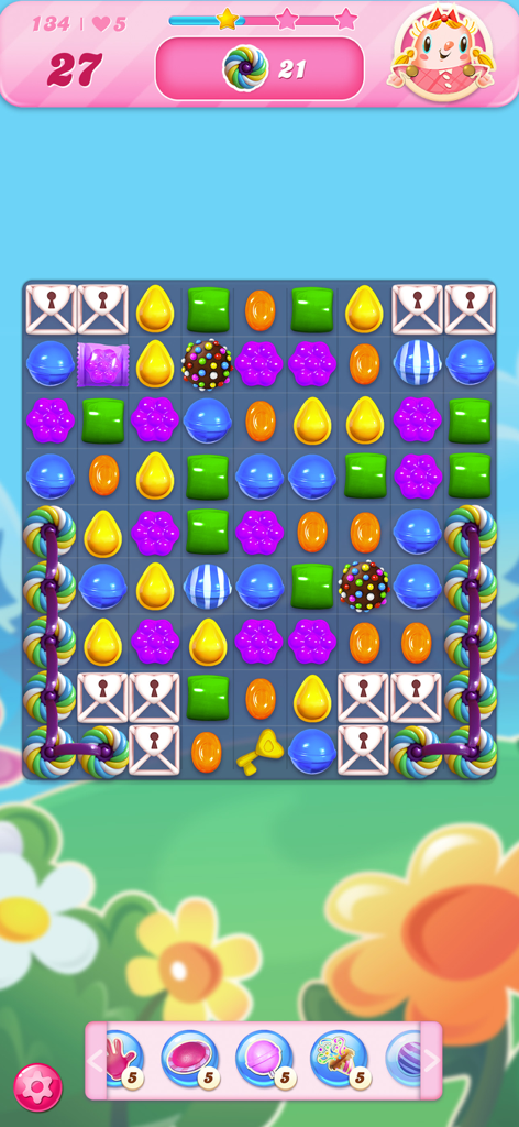 A colorful match-3 puzzle level in Candy Crush Saga featuring various candies, color bombs, and game boosters.