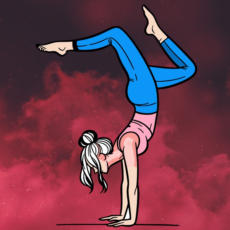 a woman doing a handstand