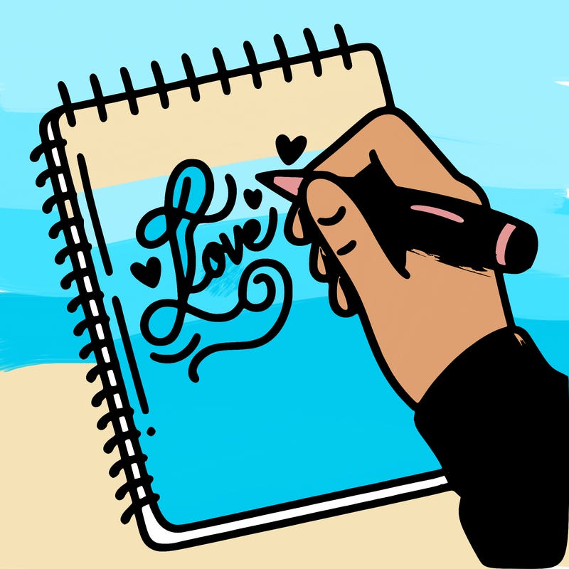 a hand writing “love” in calligraphy on a notebook