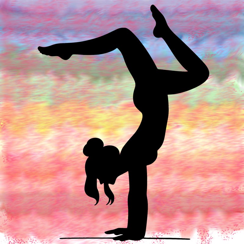 a woman doing a handstand