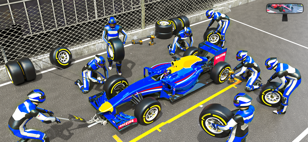 Mechanics performing a pit stop on a blue formula racing car.
