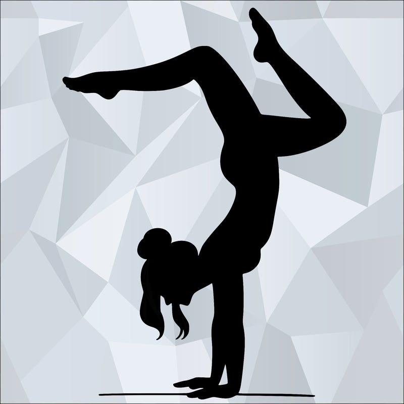 a woman doing a handstand