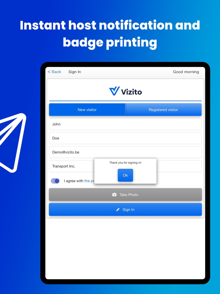 Aplicación Vizito en un iPad que muestra el formulario de registro de visitantes con una ventana emergente de confirmación de registro exitoso.