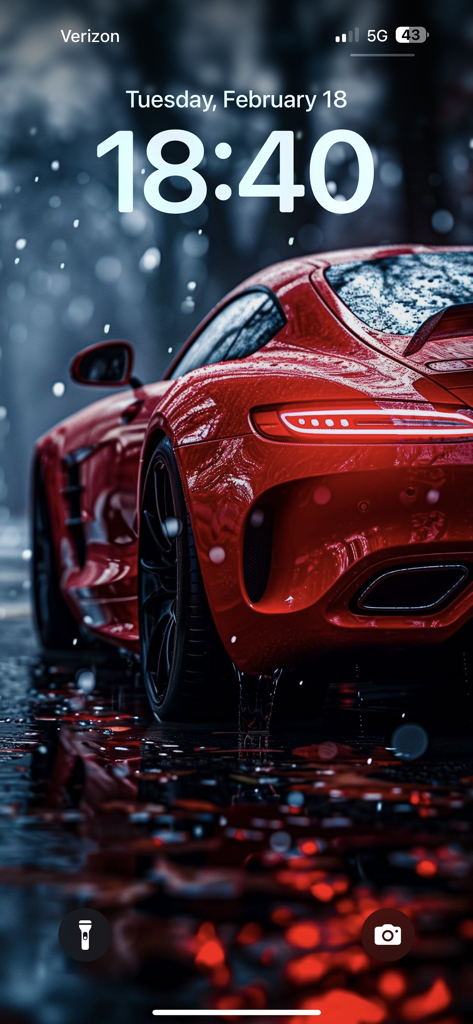 Wallpapers for phone & themes - A high-definition iPhone lock screen featuring a red sports car in a cinematic rainy setting.