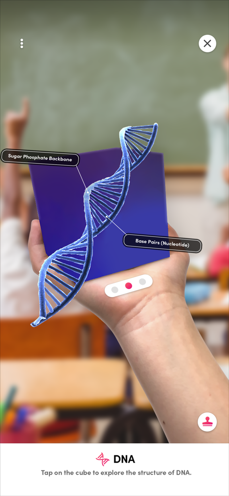 Merge Explorer - A hand holding a 3D augmented reality DNA model with labels for Sugar Phosphate Backbone and Base Pairs using the Merge Explorer app