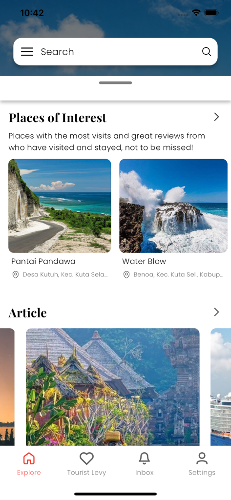 The explore screen of the Love Bali app showing popular tourist spots like Pantai Pandawa and local travel articles