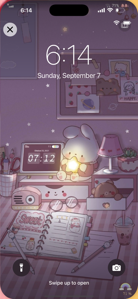 Aesthetic kawaii lock screen featuring a cute bunny character and pastel desk setup