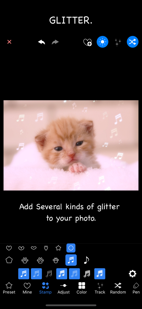 Glitter Photo Editor Lite - Glitter Photo Editor Lite interface showing musical note stamps added to a kitten photo