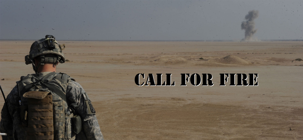 A soldier in uniform observing a desert explosion during an artillery training exercise