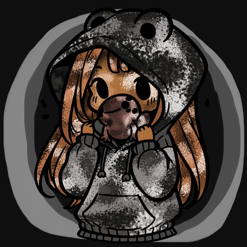 a girl holding a froggy hoodie