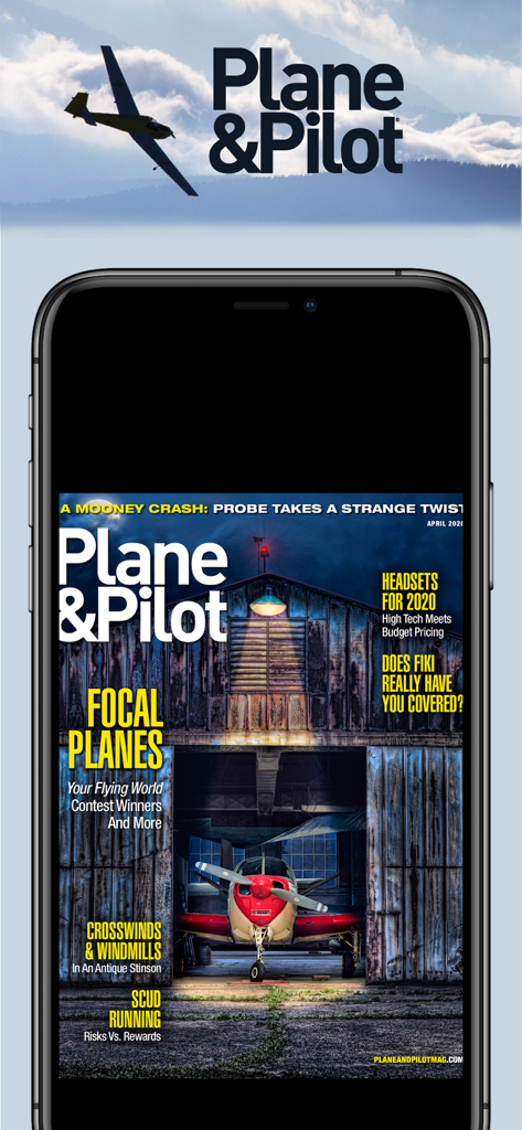 Smartphone mostrando la portada digital de la revista Plane and Pilot con un avión rojo en un hangar