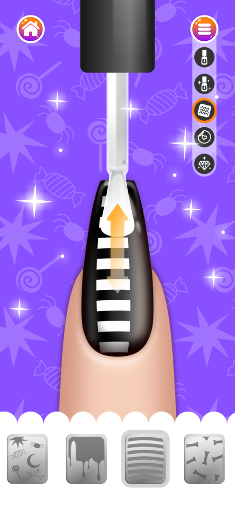 Nail Salon Games for Kids 2-5 - Peinture d'un motif à rayures noires et blanches sur un ongle dans un jeu de salon à thème Halloween pour enfants.