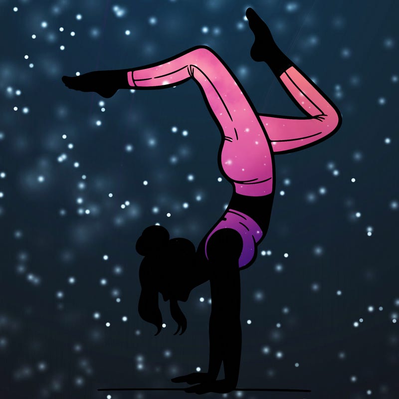 a woman doing a handstand