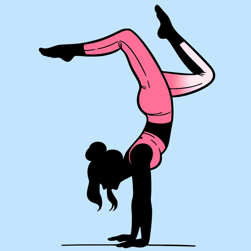 a woman doing a handstand