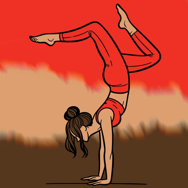a woman doing a handstand