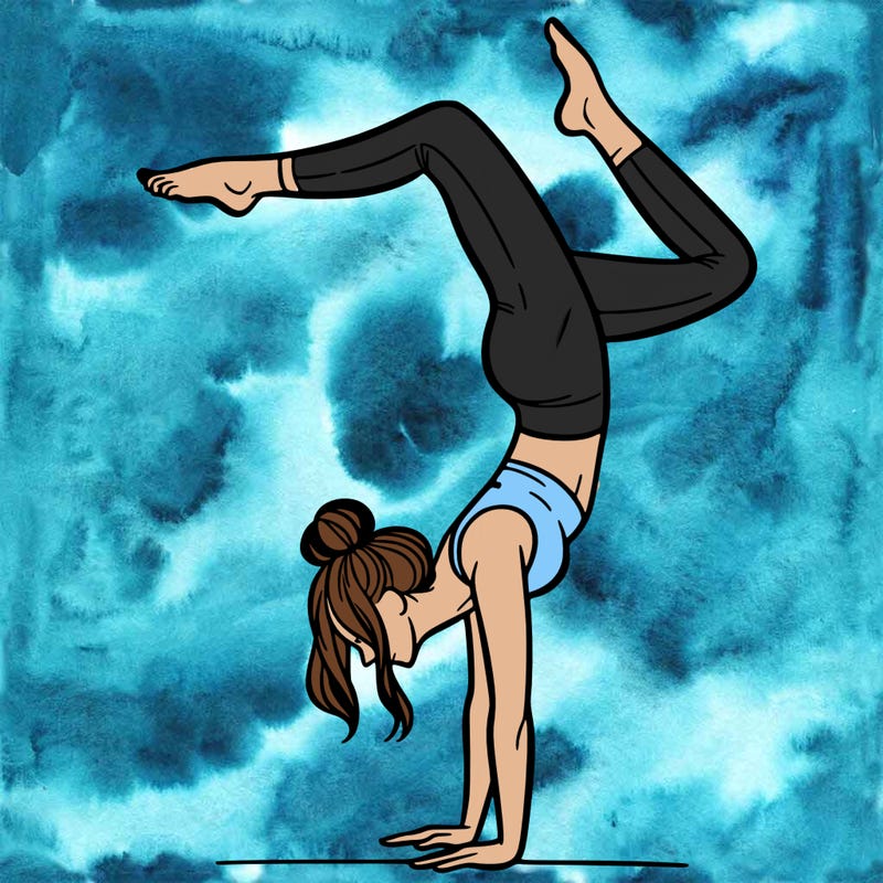 a woman doing a handstand