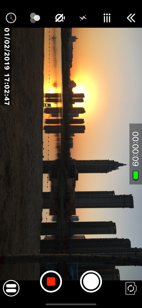 Timestamp Camera Pro - Video recording interface of Timestamp Camera Pro showing a city sunset with a precise date and time watermark.
