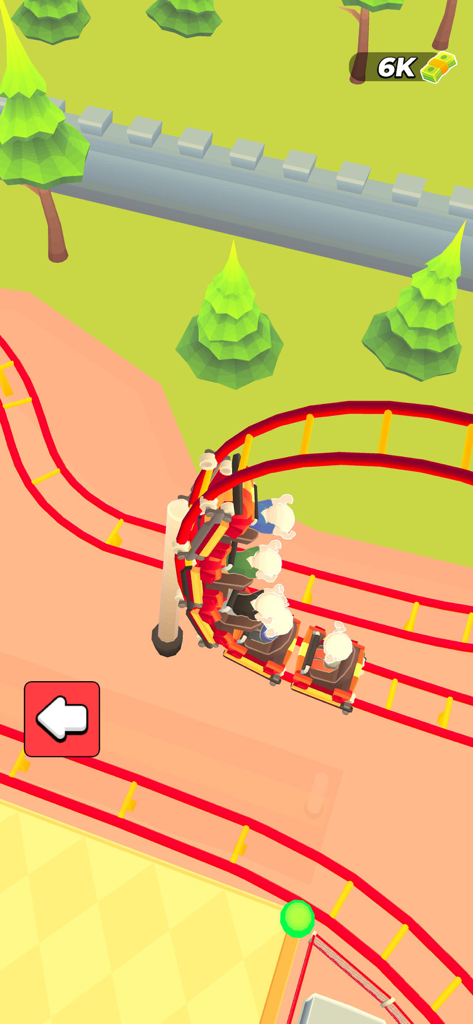 Joy Land! - Une vue de dessus d'un grand huit rouge avec des passagers dans le jeu de simulation de parc d'attractions Joy Land