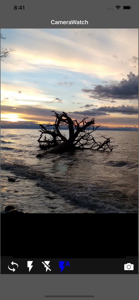 Camera Remote Watch - Camera Remote Watch app interface displaying a sunset over a lake with camera controls at the bottom