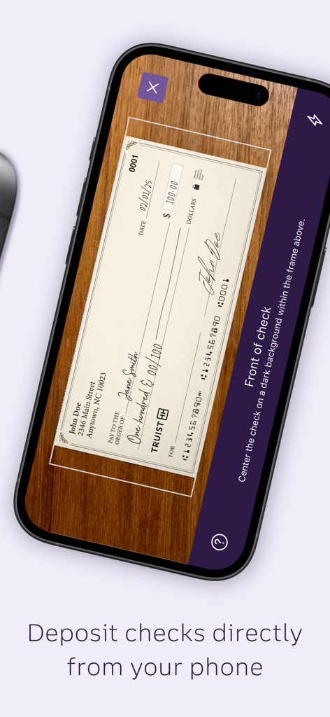 Truist Mobile app interface showing the mobile check deposit feature with a check being scanned by a smartphone camera.