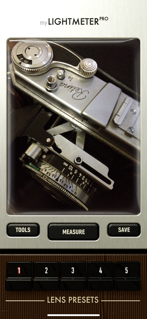 myLightMeter PRO - myLightMeter PRO app interface displaying a vintage camera through the viewfinder with measurement and lens preset buttons