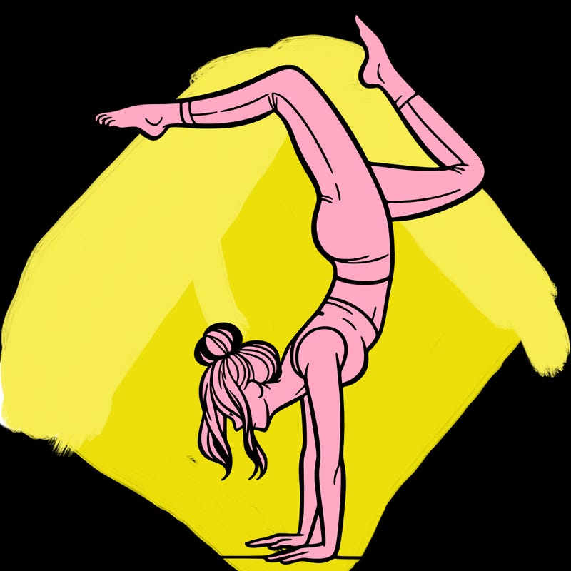 a woman doing a handstand