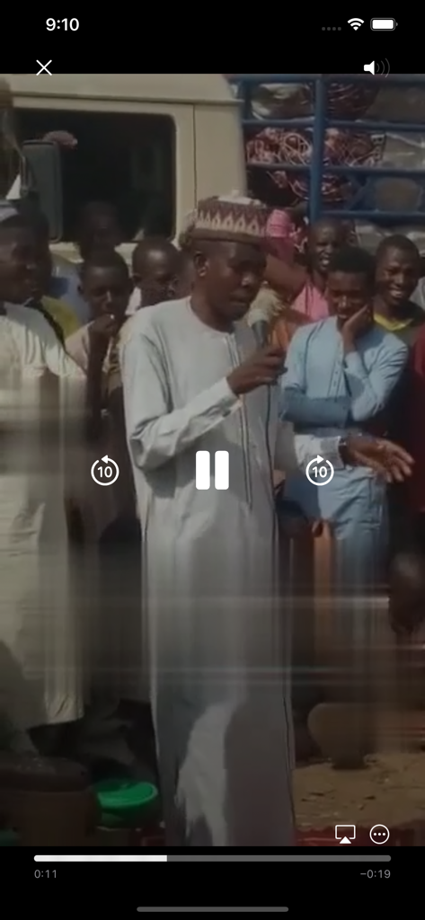 Jikan Malam Wa'azin Turmi - Video player interface showing a Hausa preacher delivering a sermon to a crowd