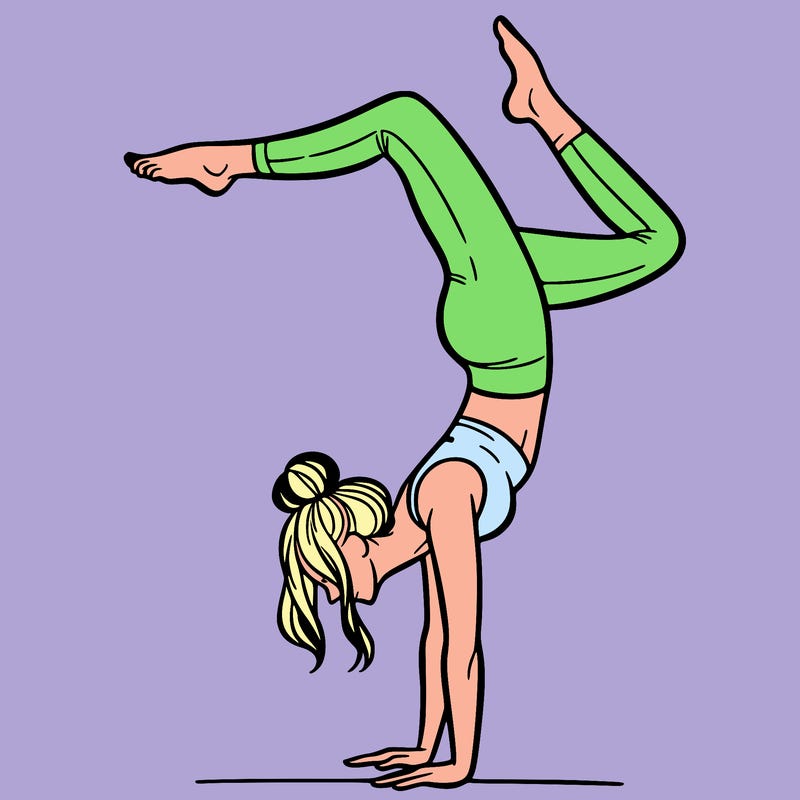 a woman doing a handstand