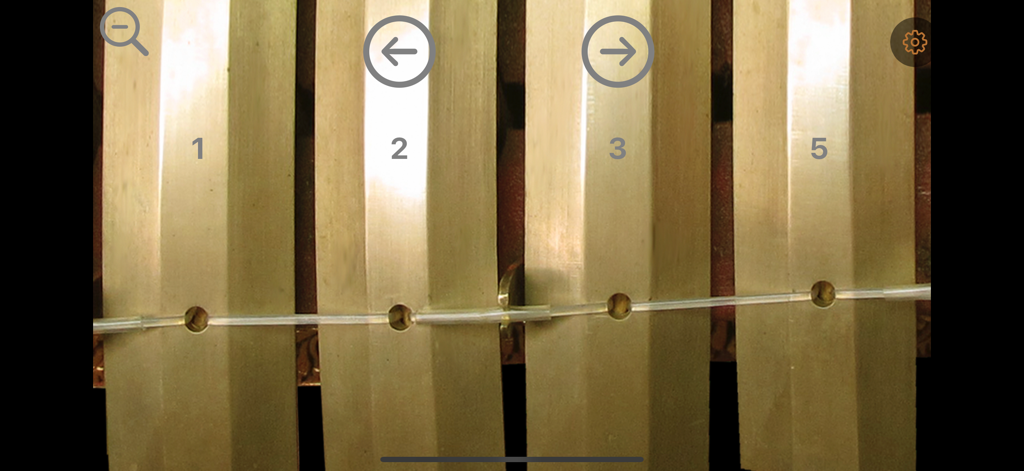 Penyacah - Close-up view of Penyacah Gamelan metallophone keys with cipher notation