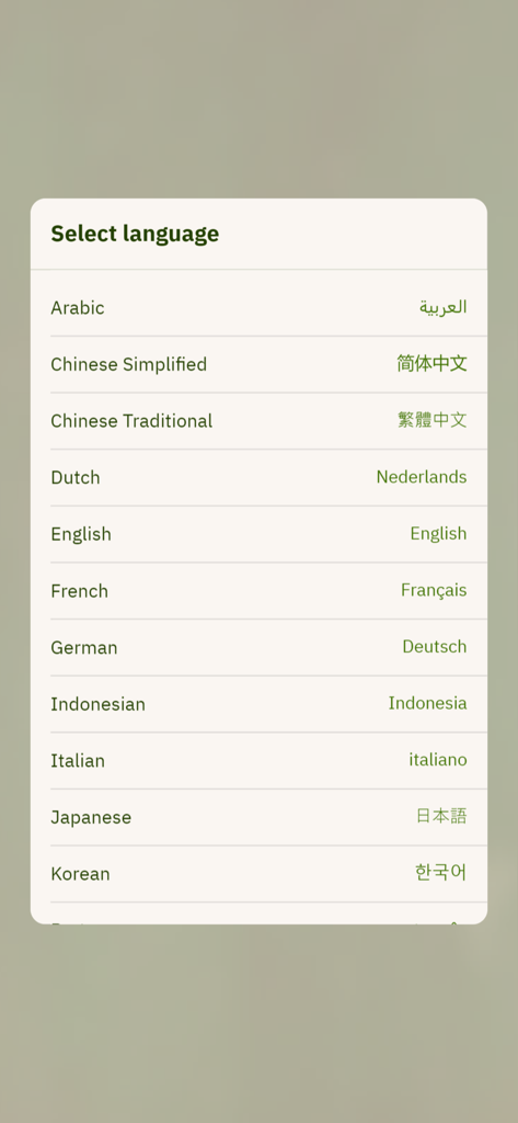 Hobbiton Tour Companion App - Menu di selezione della lingua nell'App Companion Tour Hobbiton che mostra opzioni come Arabo, Cinese, Francese e Tedesco per le traduzioni del tour.