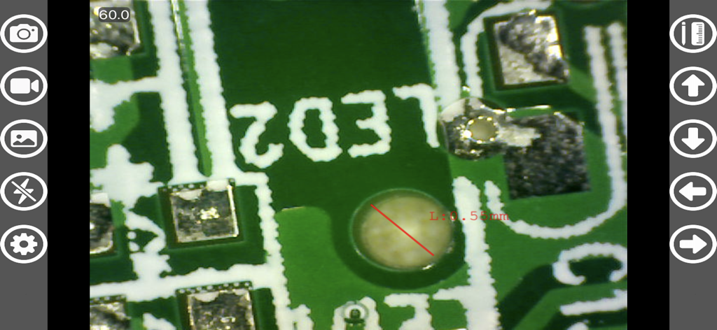 Microscopic view of a circuit board with a precise digital measurement in the Hiview Plus app interface