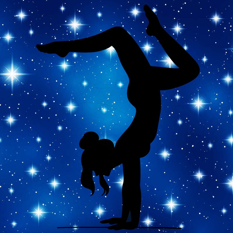 a woman doing a handstand