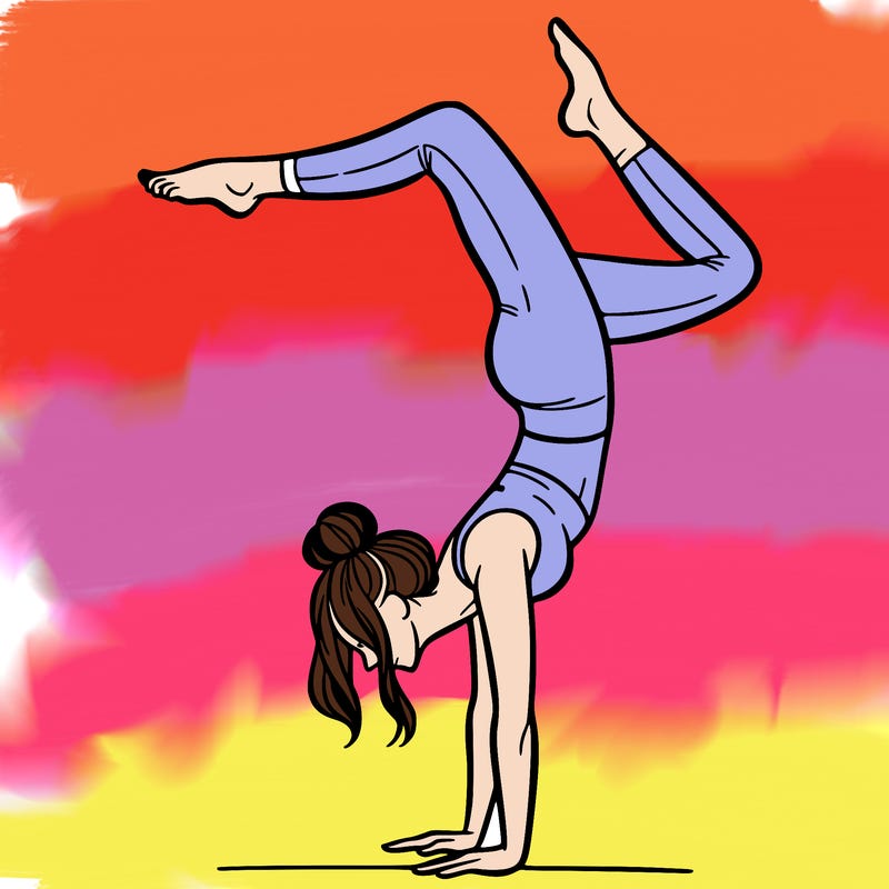 a woman doing a handstand
