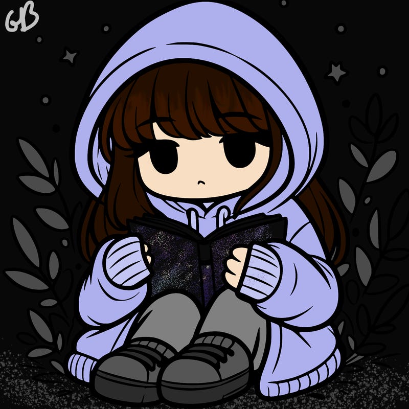 girl in oversized hoodie reading a book