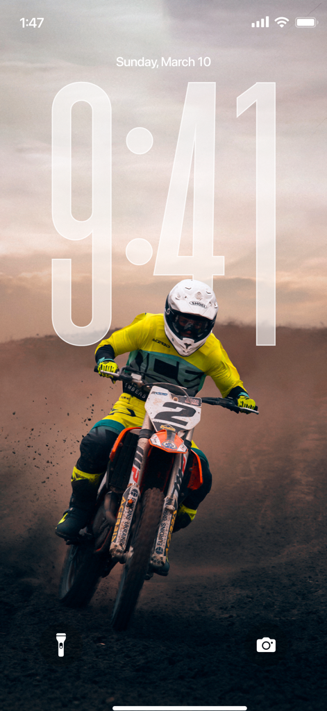 Wallpapers 4K HD Live Themes - Motocross rider on a dirt bike action wallpaper on an iPhone lock screen