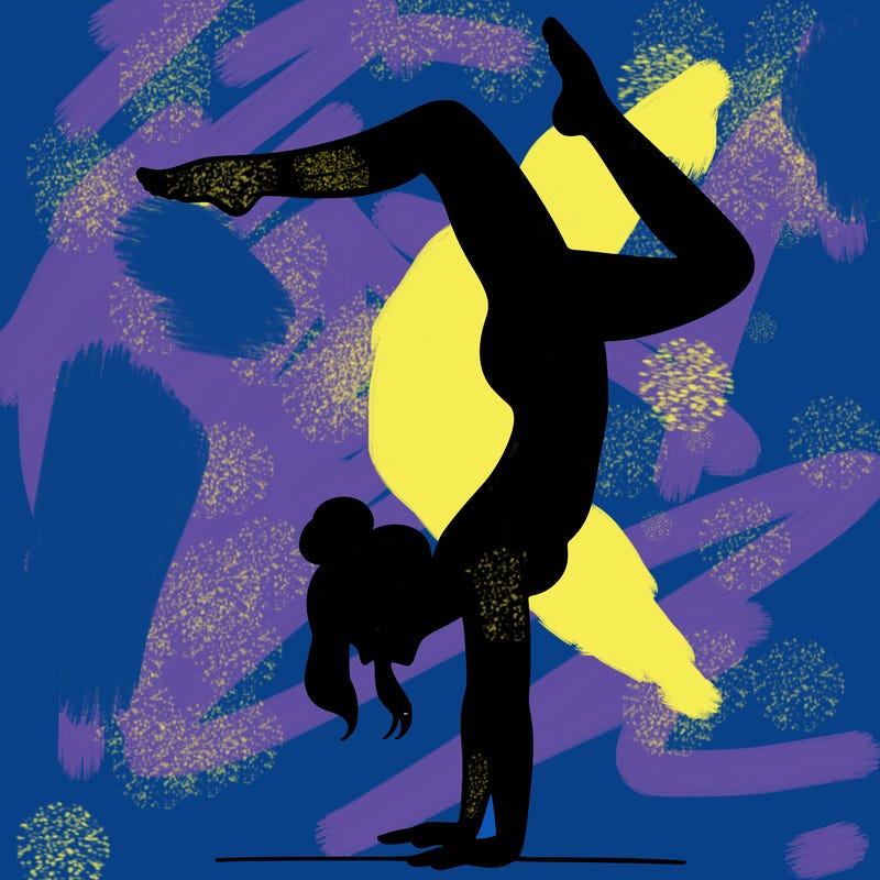 a woman doing a handstand