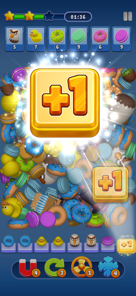 Match Manor - Match Manor gameplay showing a large plus one bonus icon over a pile of colorful 3D objects like donuts and ducks