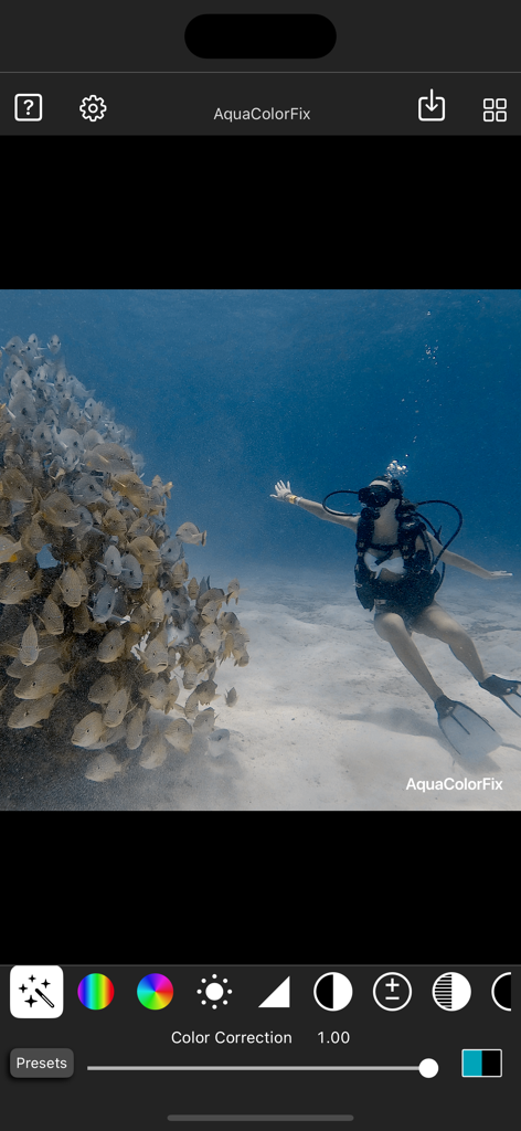 AquaColorFix - Photo & Video - AquaColorFix app interface showing the color correction of an underwater photo featuring a scuba diver and a school of fish