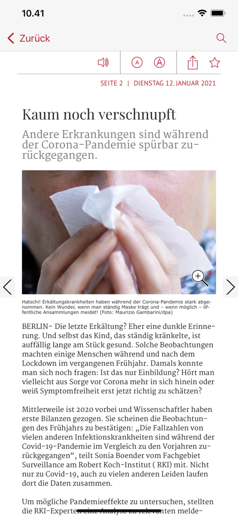 Artikelansicht in der Nürnberger Nachrichten E-Paper-App mit einem Bericht über Gesundheitstrends und einer Person, die sich die Nase putzt