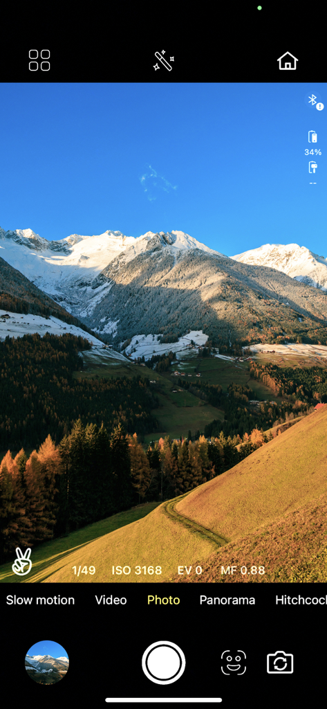 IZI GO - IZI GO app camera interface in photo mode capturing a mountain landscape