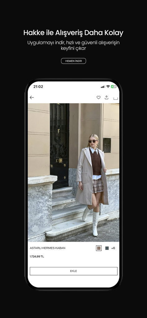 Hakke - Interfaz de la app móvil Hakke mostrando un elegante abrigo de mujer con detalles del producto y botón de añadir al carrito