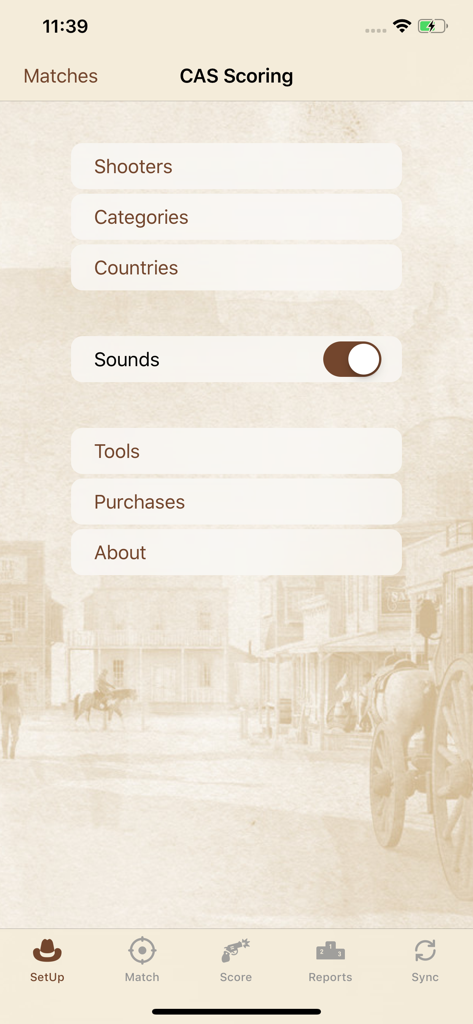 Main setup menu of the CAS Scoring app with a vintage western background