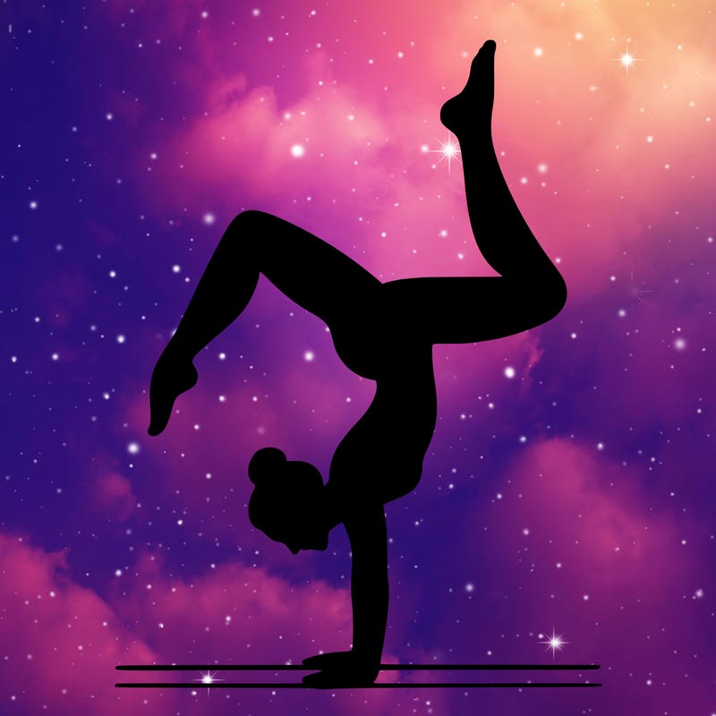 a woman doing a handstand