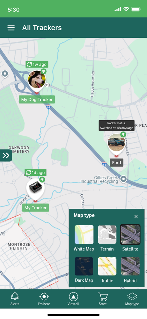 Tracki GPS mobile app showing locations for multiple trackers and various map layer options.