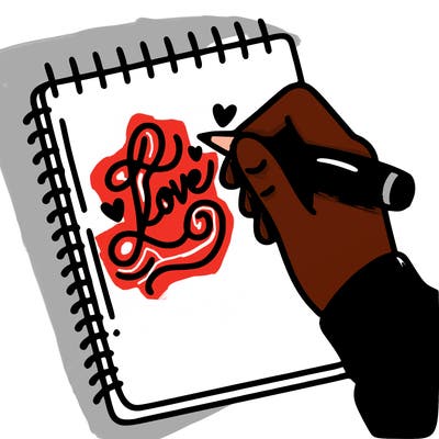 a hand writing “love” in calligraphy on a notebook